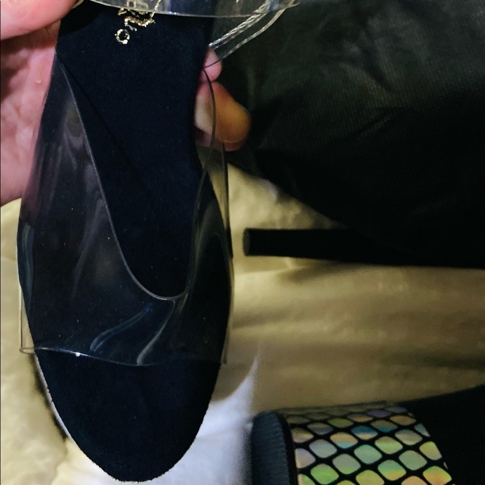 7” brand new, pleaser stilettos. Never worn with bag.